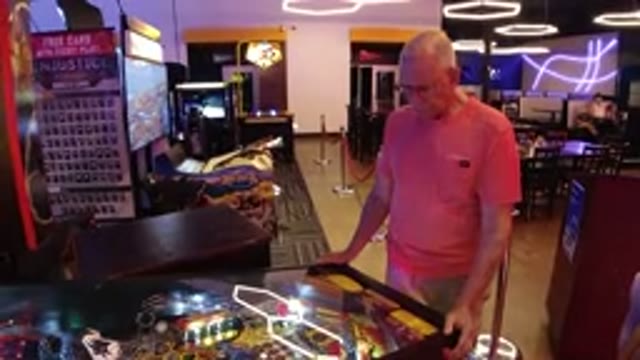 BROOMFIELD COLORADO-2019: Older Man Playing Pinball in Arcade