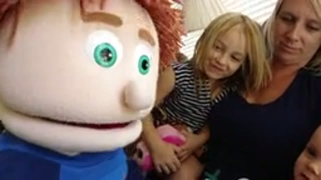 BROOMFIELD COLORADO-2019: Shaking Puppet in Front of a Female Child and Female