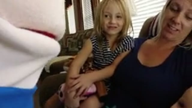 BROOMFIELD COLORADO-2019: Woman and Girls Sitting on Sofa Playing