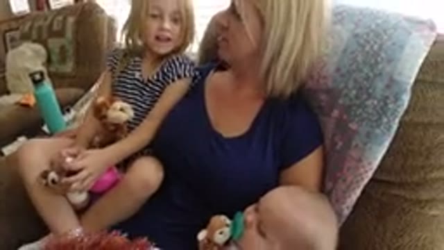BROOMFIELD COLORADO-2019: Mother With Children In A Rocking Chair