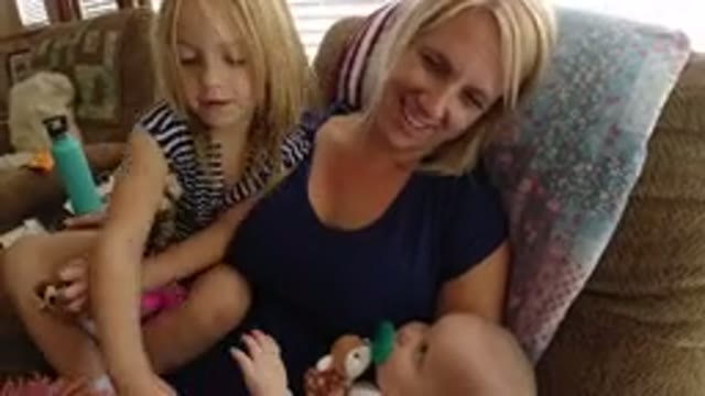 BROOMFIELD COLORADO-2019: Blonde Woman Holding A Small Baby While A Small Blonde