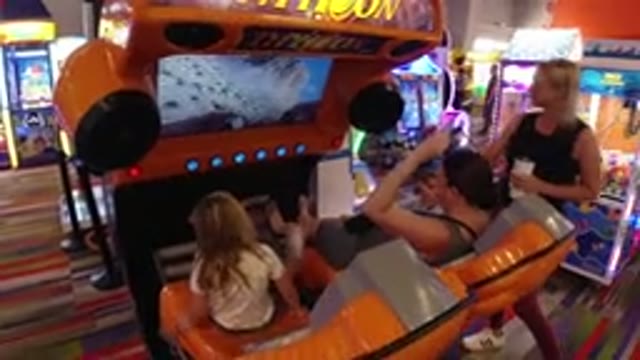 BROOMFIELD COLORADO-2019: A Little Girl Is Sitting At A Video Game Console With