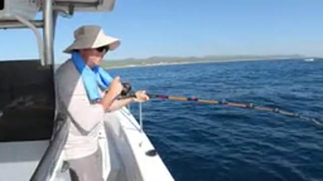 LOS CABOS MEXICO-2019: A Person Fishing On A Boat In The Ocean