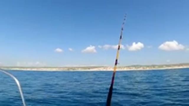 LOS CABOS MEXICO-2019: Driving A Boat And Fishing On A Sunny Day