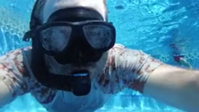 LOS CABOS MEXICO-2019: Swimmer in T-Shirt Testing Goggles and Rebreather