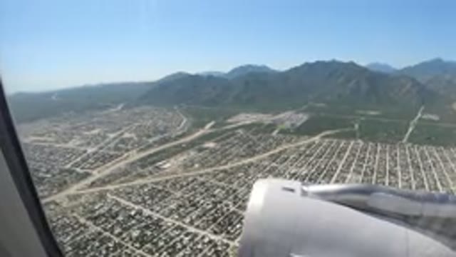 LOS CABOS MEXICO-2019: An Aerial View Of A City In A Mountain Valley With A Jet