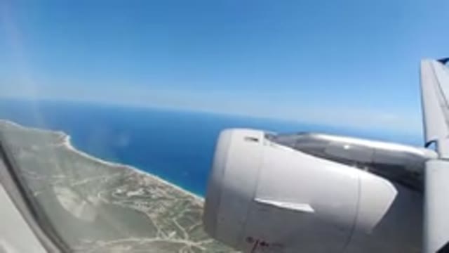 LOS CABOS MEXICO-2019: On The Planner Shooting Through Window River Or Sea And