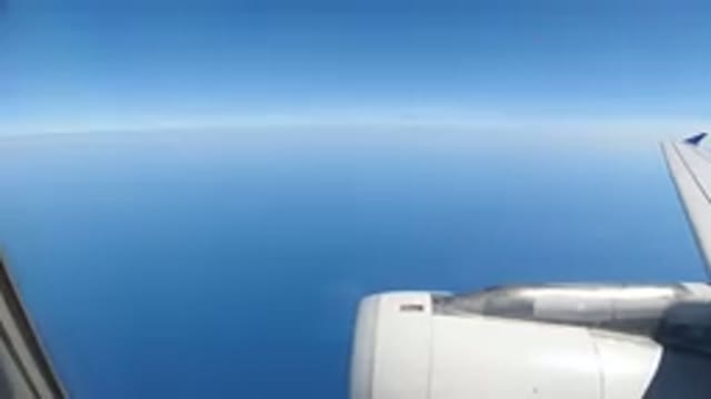 LOS CABOS MEXICO-2019: Plane Camera Of A Jet Engine Flying Through The Open Blue