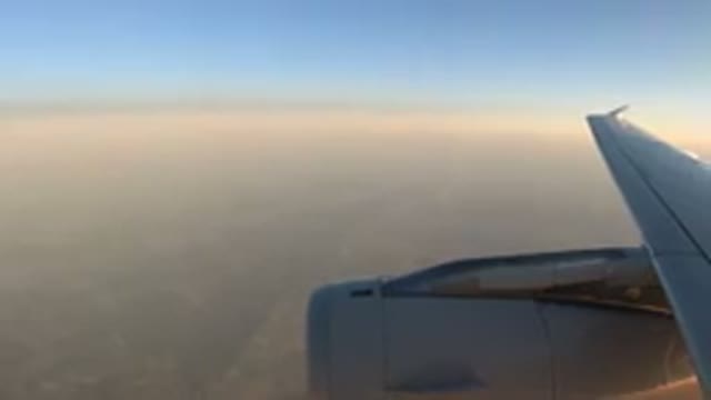LOS CABOS MEXICO-2019: An Airplane Flying in the Blue Sky Over the Clouds