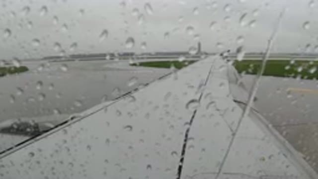 LOS CABOS MEXICO-2019: A View Of The Rain From Inside An Airplane With Raindrops