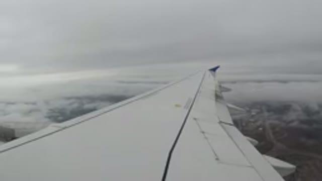 LOS CABOS MEXICO-2019: Plane Passing Under A Cloudy Sky From An Unknown Place