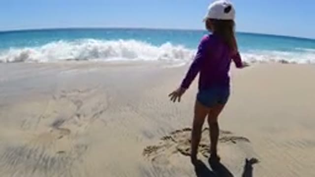 LOS CABOS MEXICO-2019: Sandy Beach Front Property With A Little Kid Playing On