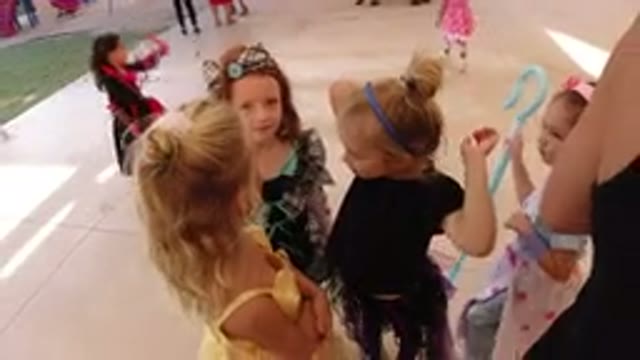 LOS CABOS MEXICO-2019: Little Girls Dressed In Costumes At A Party Yard Helping