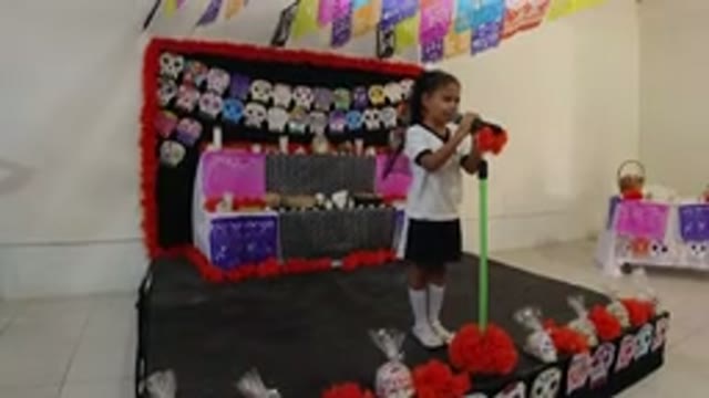 LOS CABOS MEXICO-2019: Girl Singing At Halloween School Party Surrounded By