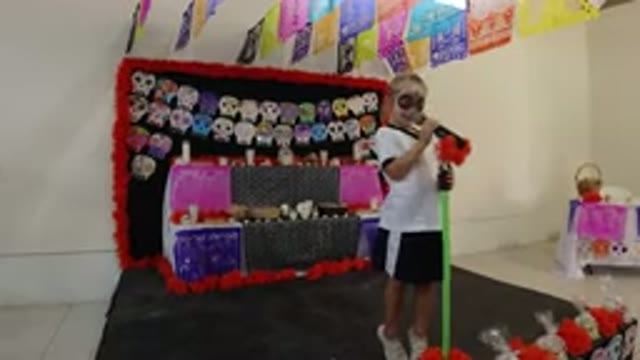 LOS CABOS MEXICO-2019: Young Girl With Face Paint Sings On Stage