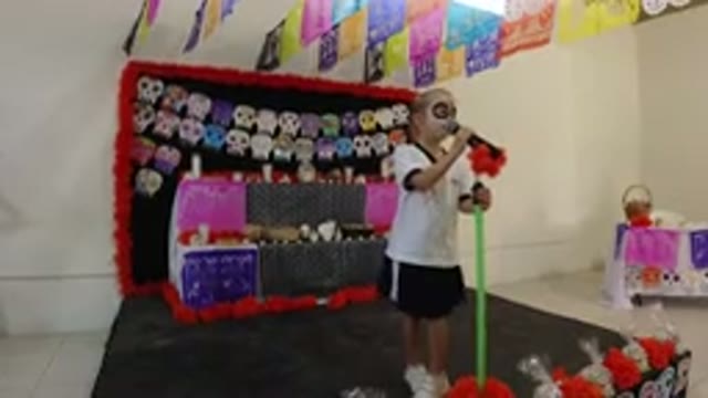 LOS CABOS MEXICO-2019: A Kid In Black And White Dress Standing On Stage And Talking