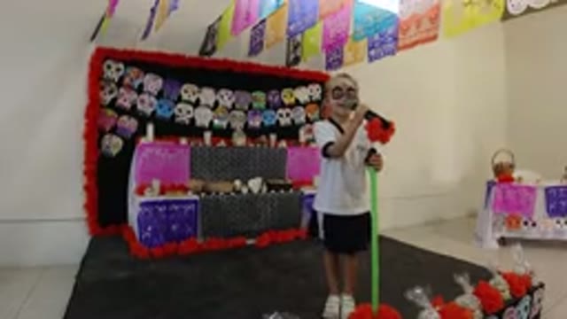 LOS CABOS MEXICO-2019: Child Sings Song At Day of the Dead Celebration