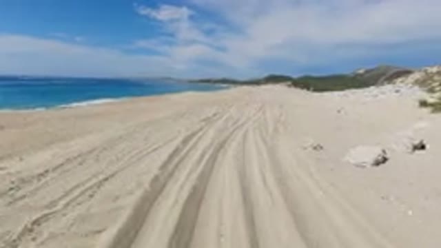 LOS CABOS MEXICO-2019: Fast Beach Drive On A Sunny Day Along A Well Used Trail