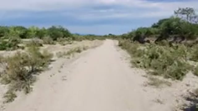 LOS CABOS MEXICO-2019: Driving Fast Through A Sandy Desert Area On A Secluded