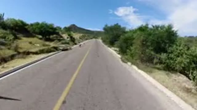 LOS CABOS MEXICO-2019: Romantic Couple Traveling on Soft Road with Mountains and Sky