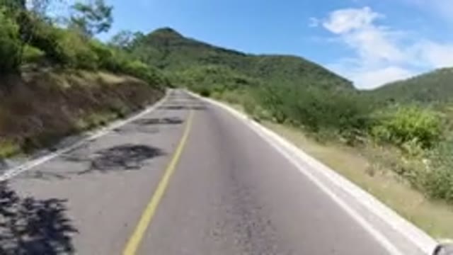LOS CABOS MEXICO-2019: A Wrangler Traveling On Mountain Road With Lush Green