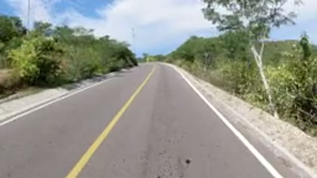 LOS CABOS MEXICO-2019: Driving A Wrangler Up A Freeway Curve With Beautiful View