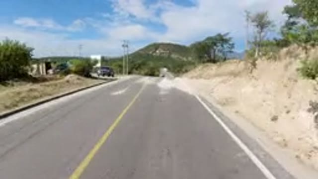 LOS CABOS MEXICO-2019: A View Of The Road With Wranglers Driving By On A Cloudy Day