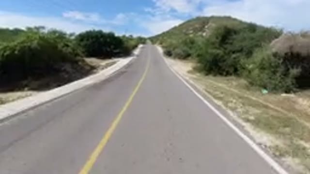 LOS CABOS MEXICO-2019: A Two-Way Road In A Terrain Of Hills With Arid And Rocky