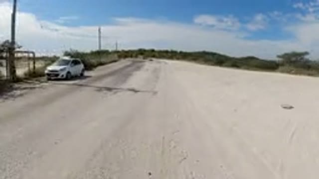 LOS CABOS MEXICO-2019: Traveling On A Sand Covered Divided Road Passing A