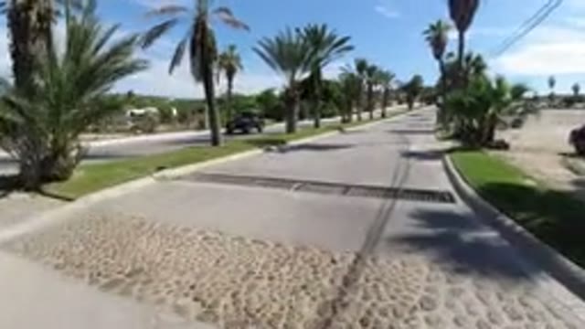 LOS CABOS MEXICO-2019: Camera Moving Down A Large Stretch Of Developed Roadway