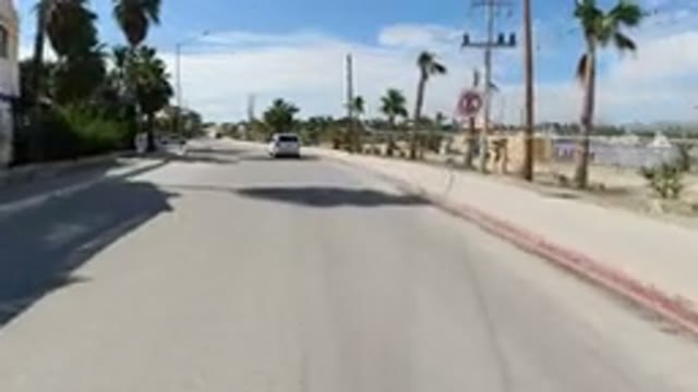 LOS CABOS MEXICO-2019: Van Cruises Along The Beach Road With Another Wrangler In