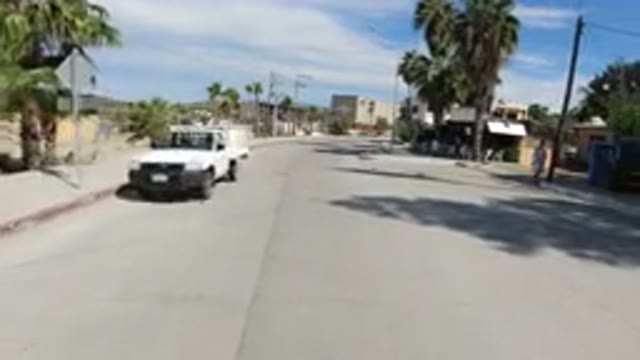 LOS CABOS MEXICO-2019: Vehicle Moves Down City Street Then Pulls In And Parks In