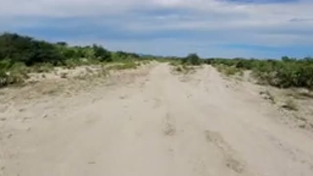 LOS CABOS MEXICO-2019: A View Of Sand And Dirt Road On A Cloudy Day