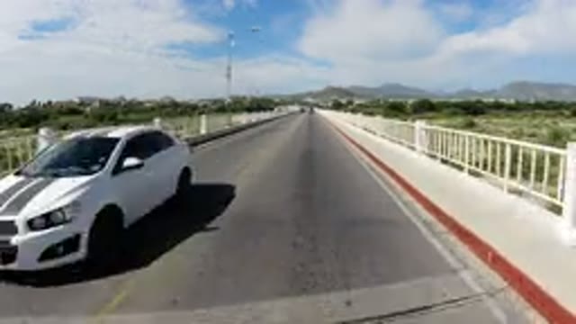 LOS CABOS MEXICO-2019: View From A Vehicle Traveling Across A Paved Bridge