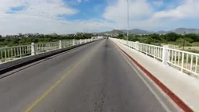 LOS CABOS MEXICO-2019: Traveling Over A Bridge With Oncoming Traffic Two