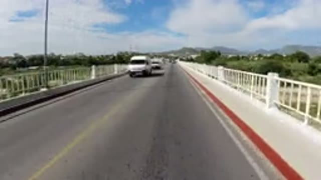 LOS CABOS MEXICO-2019: Wrangler Zooming Down The Road As Traffic Flows By