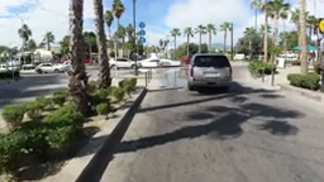 LOS CABOS MEXICO-2019: Vehicle Entering Roundabout With Traffic On A Sunny Day