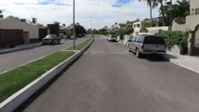 LOS CABOS MEXICO-2019: Front View of Houses Along Roadside with Vehicle Parking