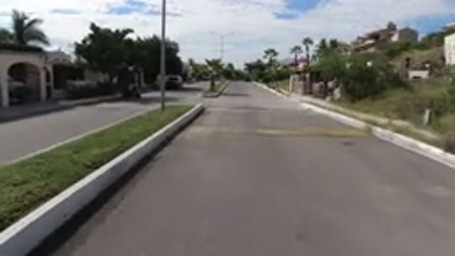 LOS CABOS MEXICO-2019: Driving Down A Suburban Neighborhood On A Sunny Day With Palm Trees