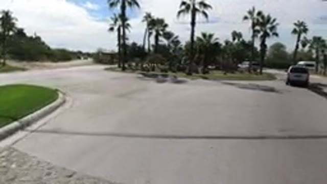 LOS CABOS MEXICO-2019: Driving On A Roundabout Road In A Tropical Setting With