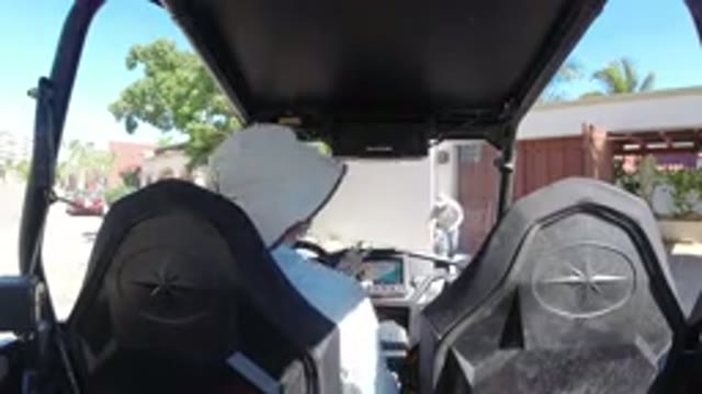 LOS CABOS MEXICO-2019: A Man Sitting On The Wrangler And Setting Something