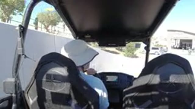LOS CABOS MEXICO-2019: A Person Wearing A Hat Drives A Vehicle On A Sunny Day