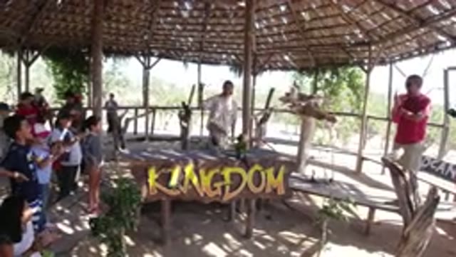 LOS CABOS MEXICO-2019: Young People Outside Clapping While A Man Shows Them A Bird
