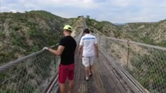 LOS CABOS MEXICO-2019: Two Close Friends Crossing The Hanging Bridge in Los