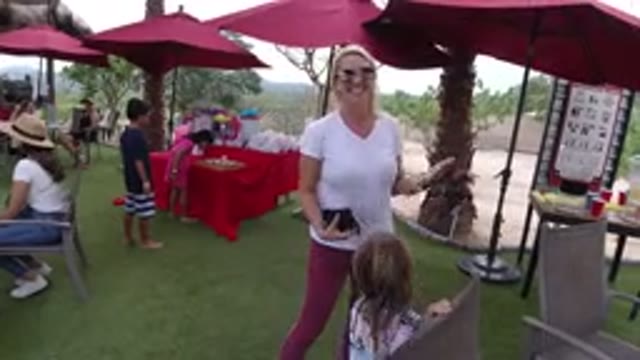 LOS CABOS MEXICO-2019: Lady Blowing A Kiss To The Camera With A Little Girl At A Fair