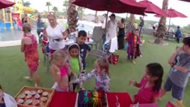 LOS CABOS MEXICO-2019: Children Surrounding A Fair Stall With Pictures