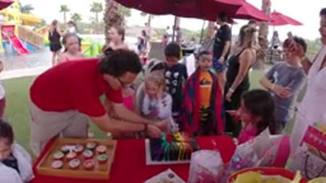 LOS CABOS MEXICO-2019: Mom Lights Colorful Candles At The Park On Daughter's Birthday