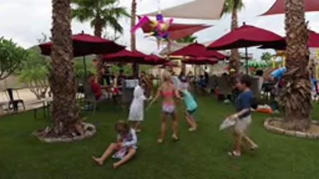 LOS CABOS MEXICO-2019: Happy Children At A Party In A Garden While They Are Hitting A Pinata