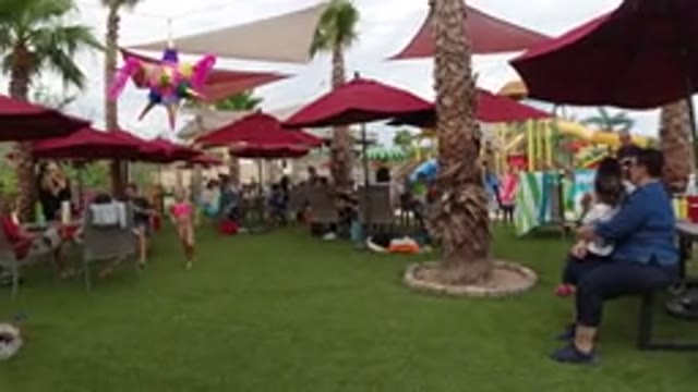 LOS CABOS MEXICO-2019: At A Resort People Sit Under Red Umbrellas As Kids Run