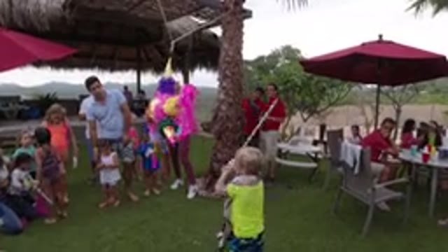 LOS CABOS MEXICO-2019: A Child At A Birthday Party Striking At A Figure